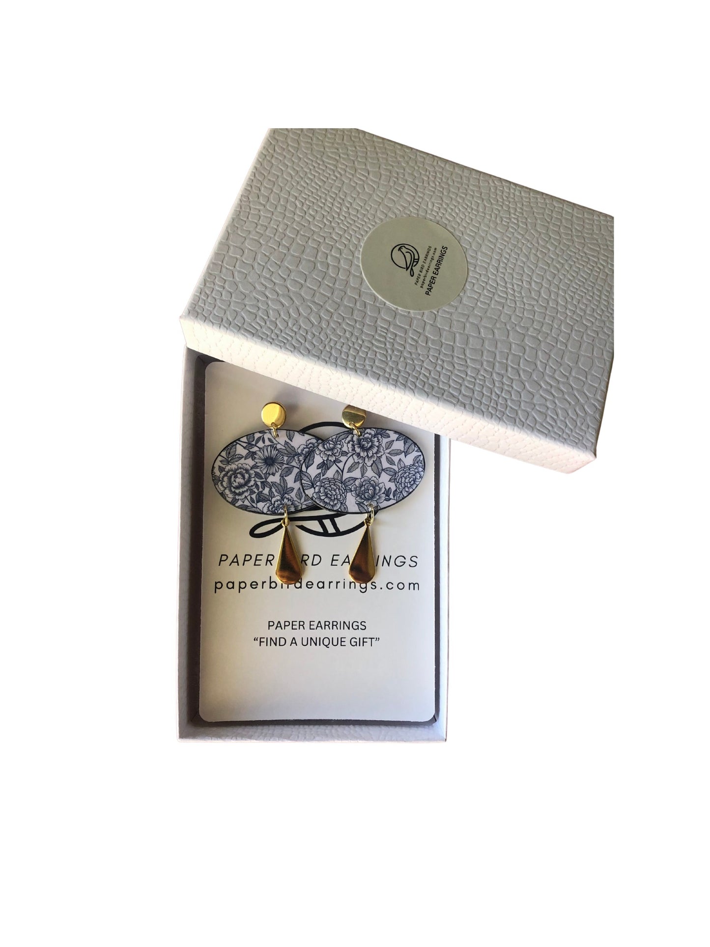 Earrings in a branded box with a white background