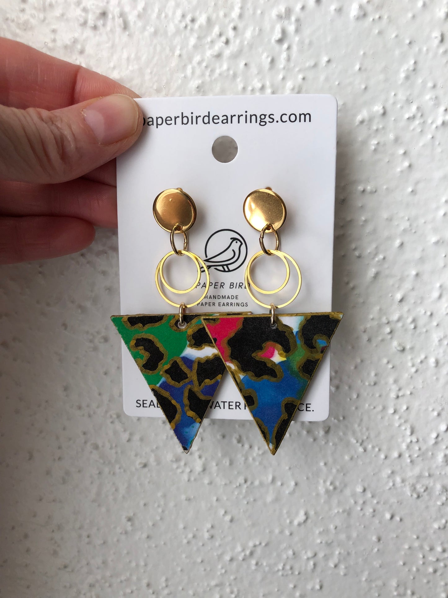 triangle paper earrings with green leopard design