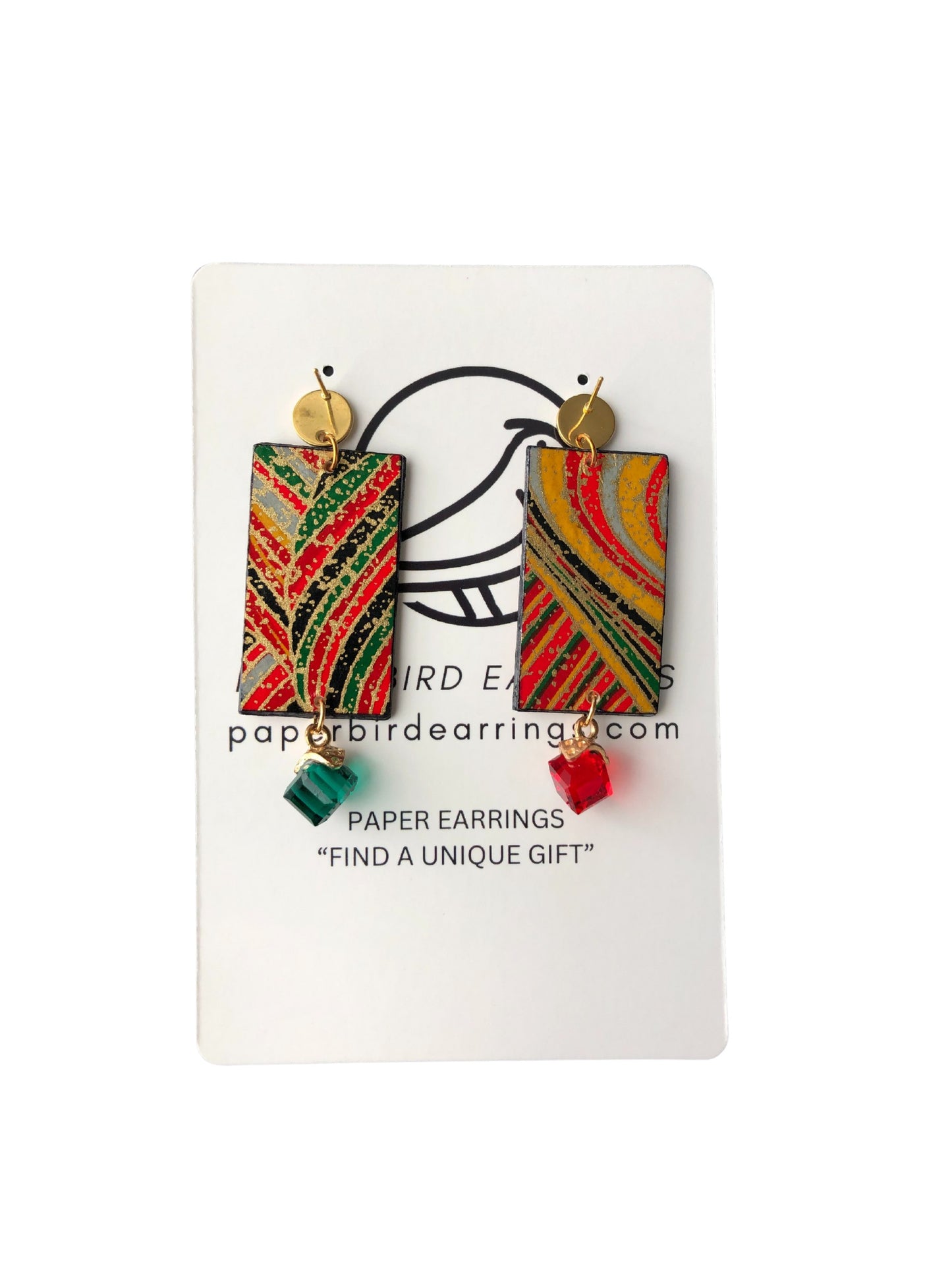 Colorful paper earrings on a branded card with 'paperbirdearring.com' text.