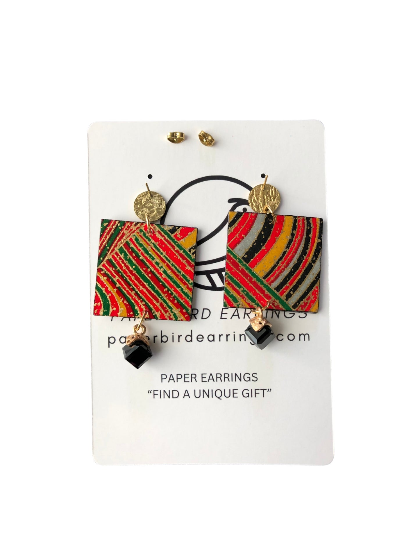 Colorful paper earrings on a white card with branding text.