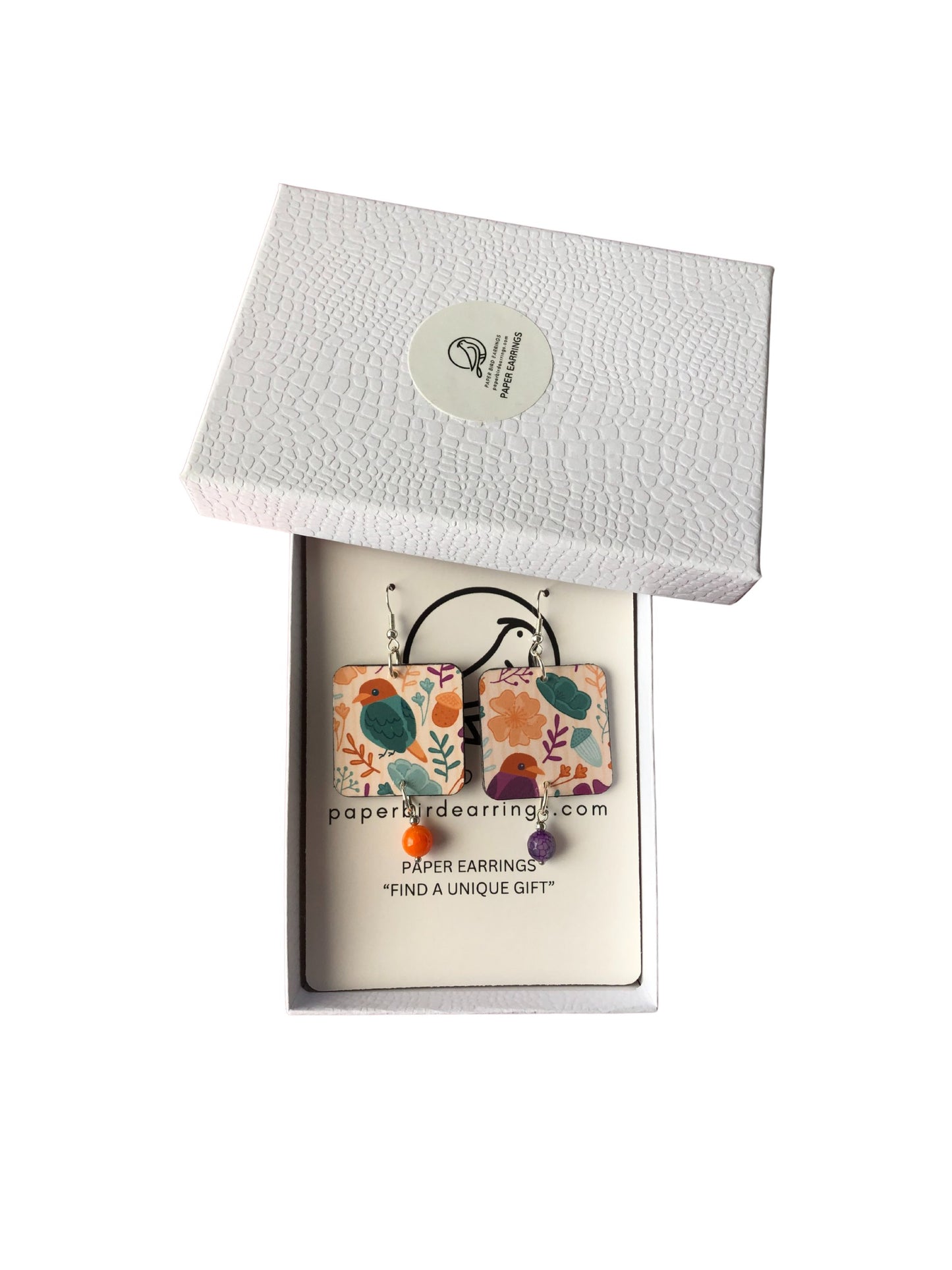 Floral paper earring set in a white box with a visible brand logo.