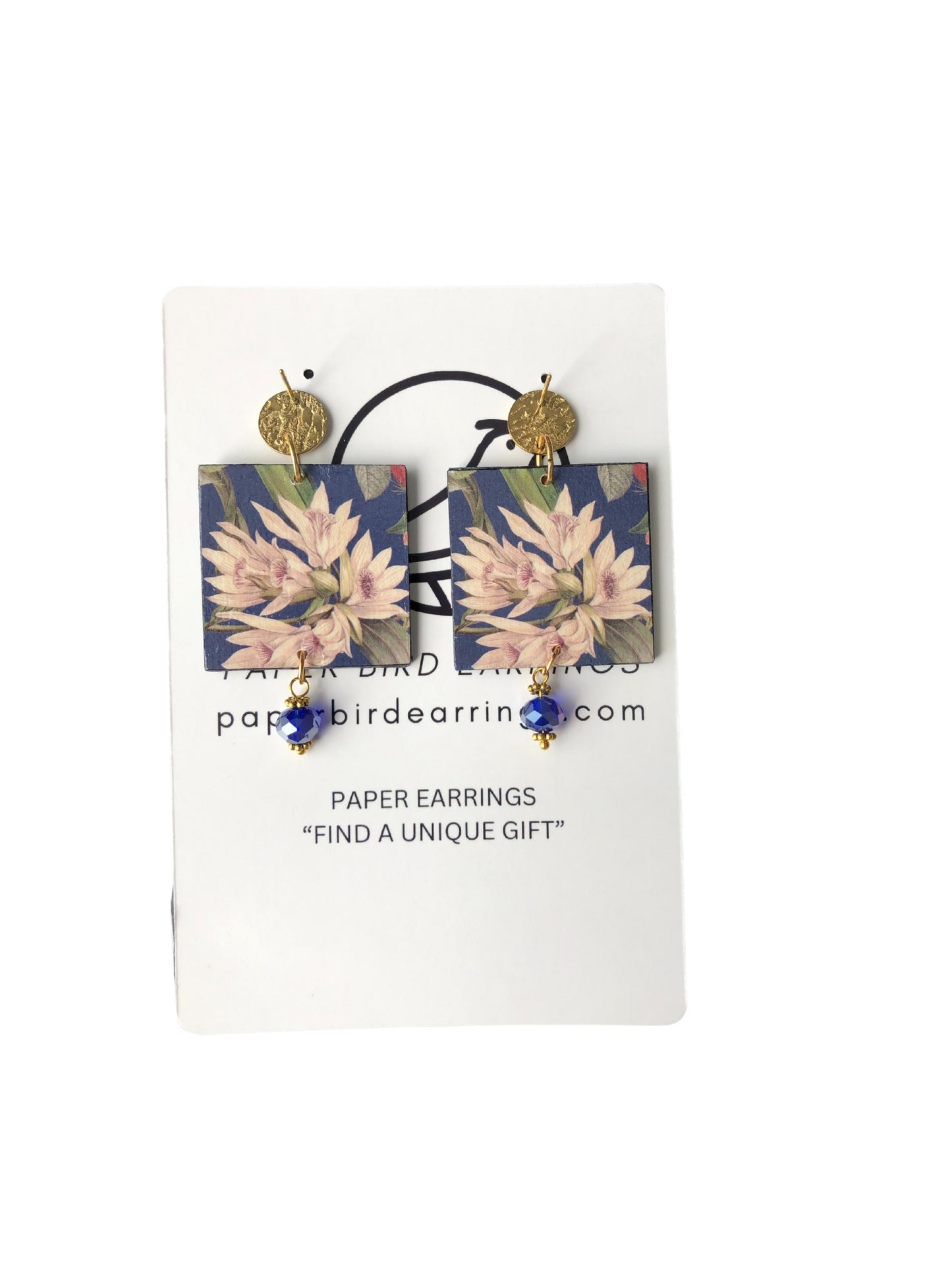Floral paper earrings on a white card with 'Paper Bird Earrings' branding.