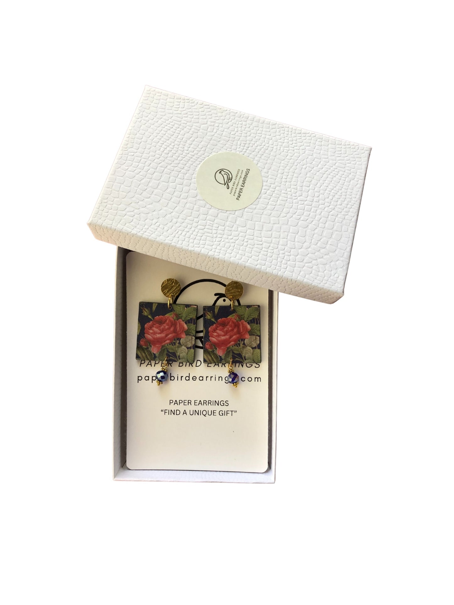 Earring box with floral design and brand name on a white background