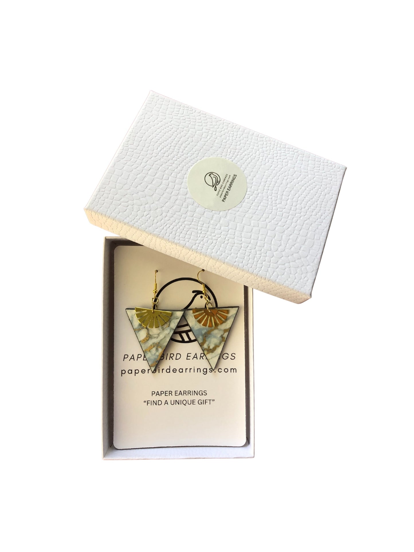 Paper earrings in a white box with branding on a white background