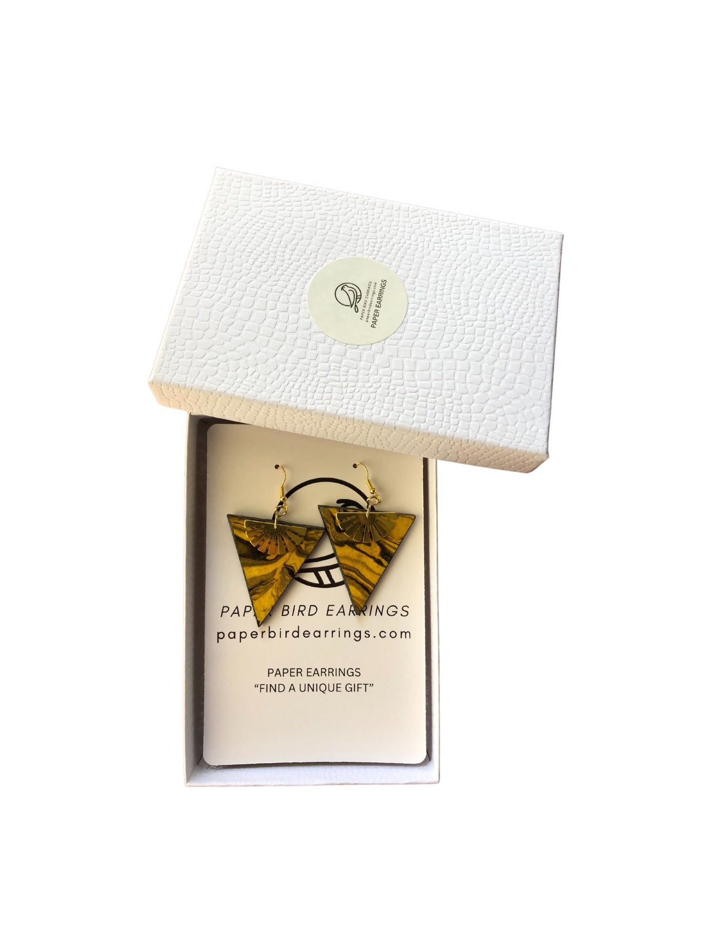 Pair of paper earrings in a branded box on a white background