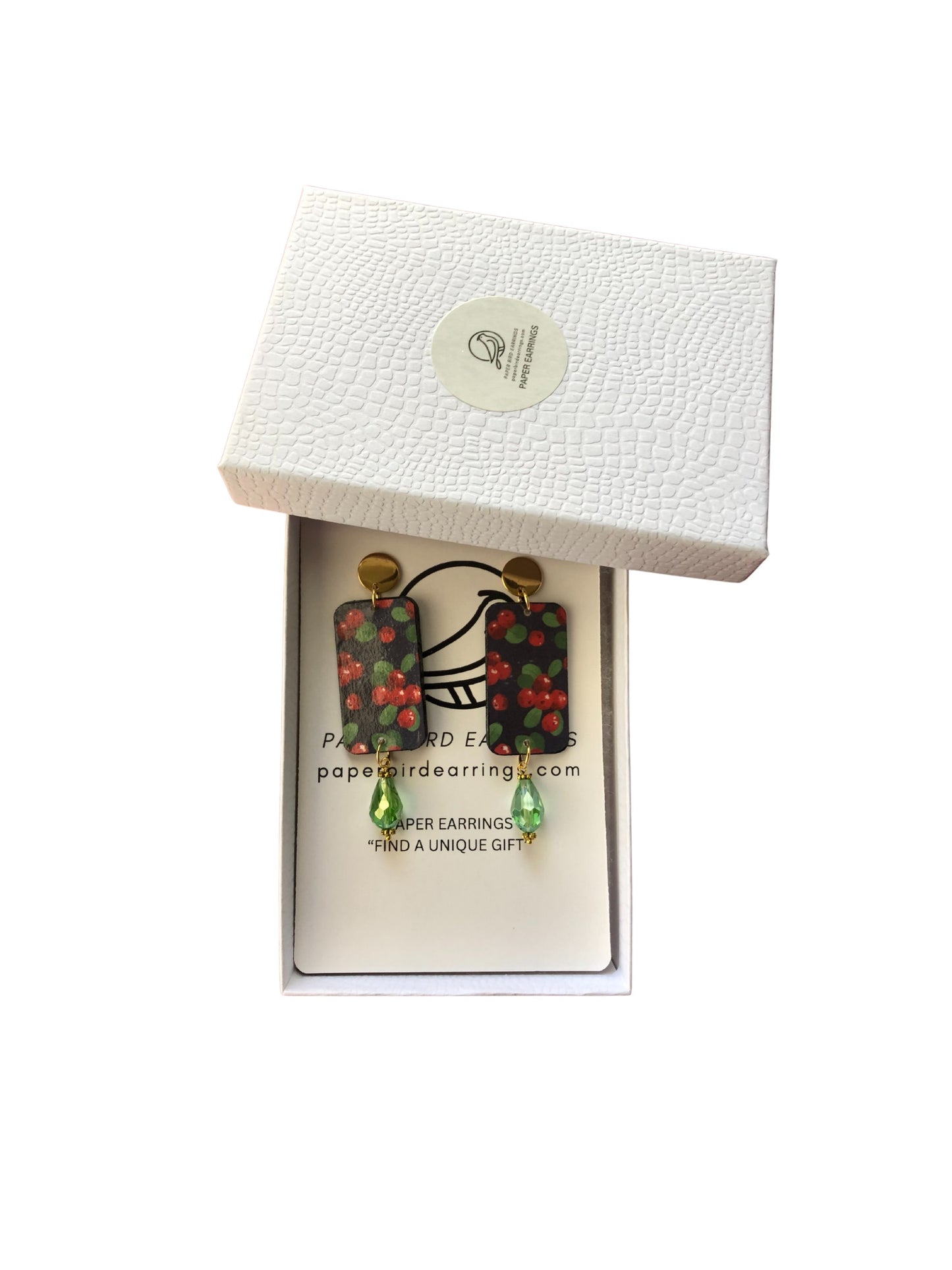 Pair of earrings in a white box with a visible brand label.