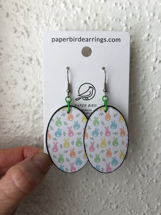 oval white earrings with colorful bunnies