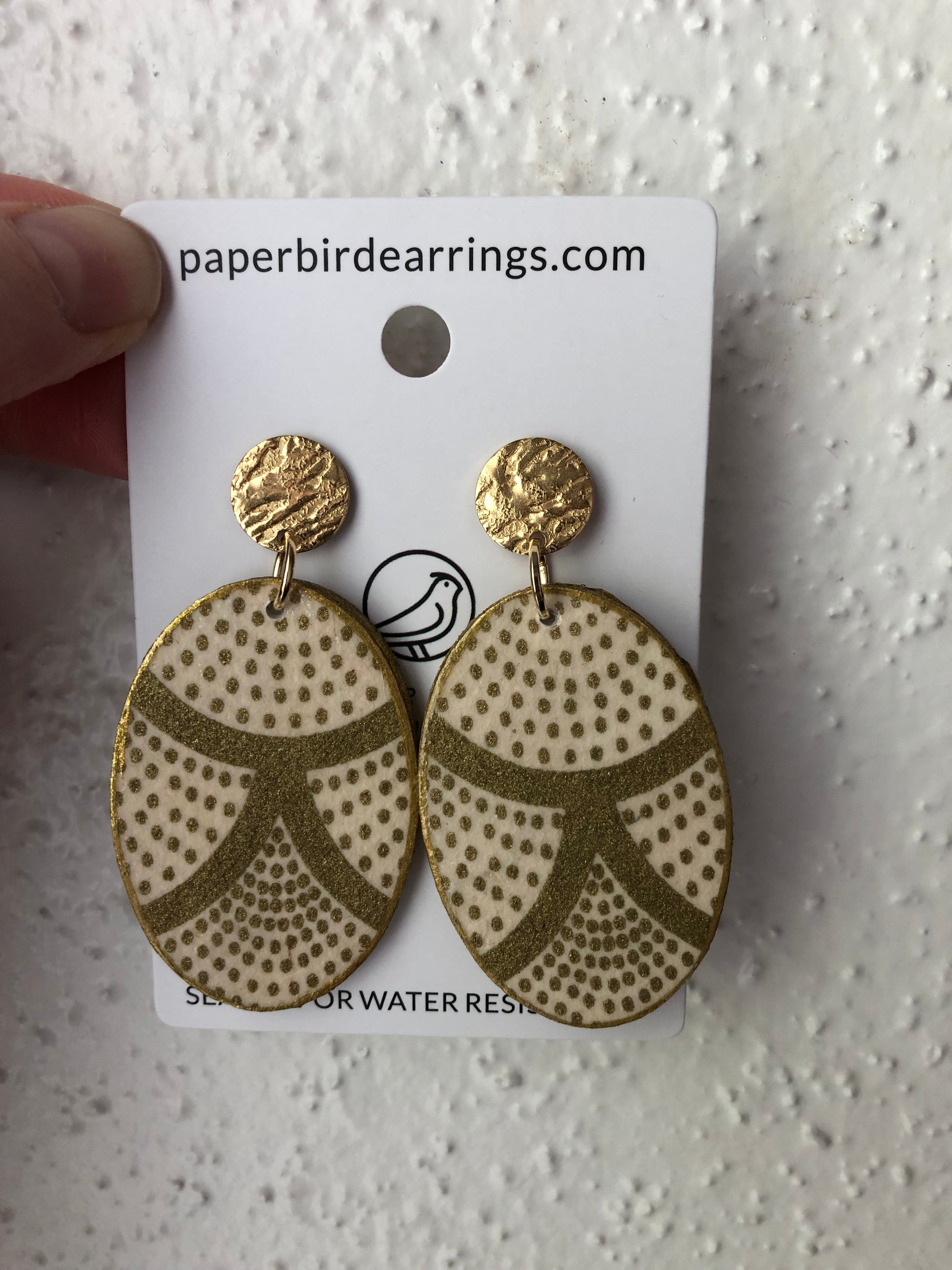 oval paper earrings with golden dots design