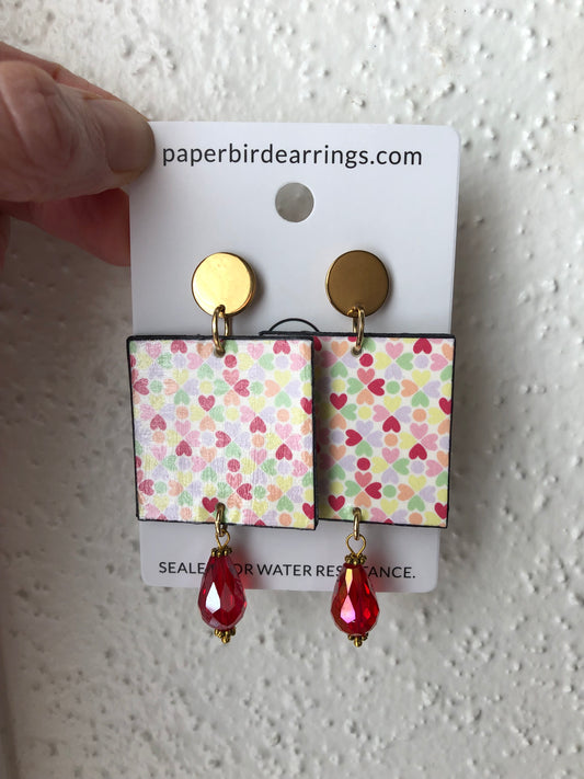 square paper earrings with multicolor hearts design