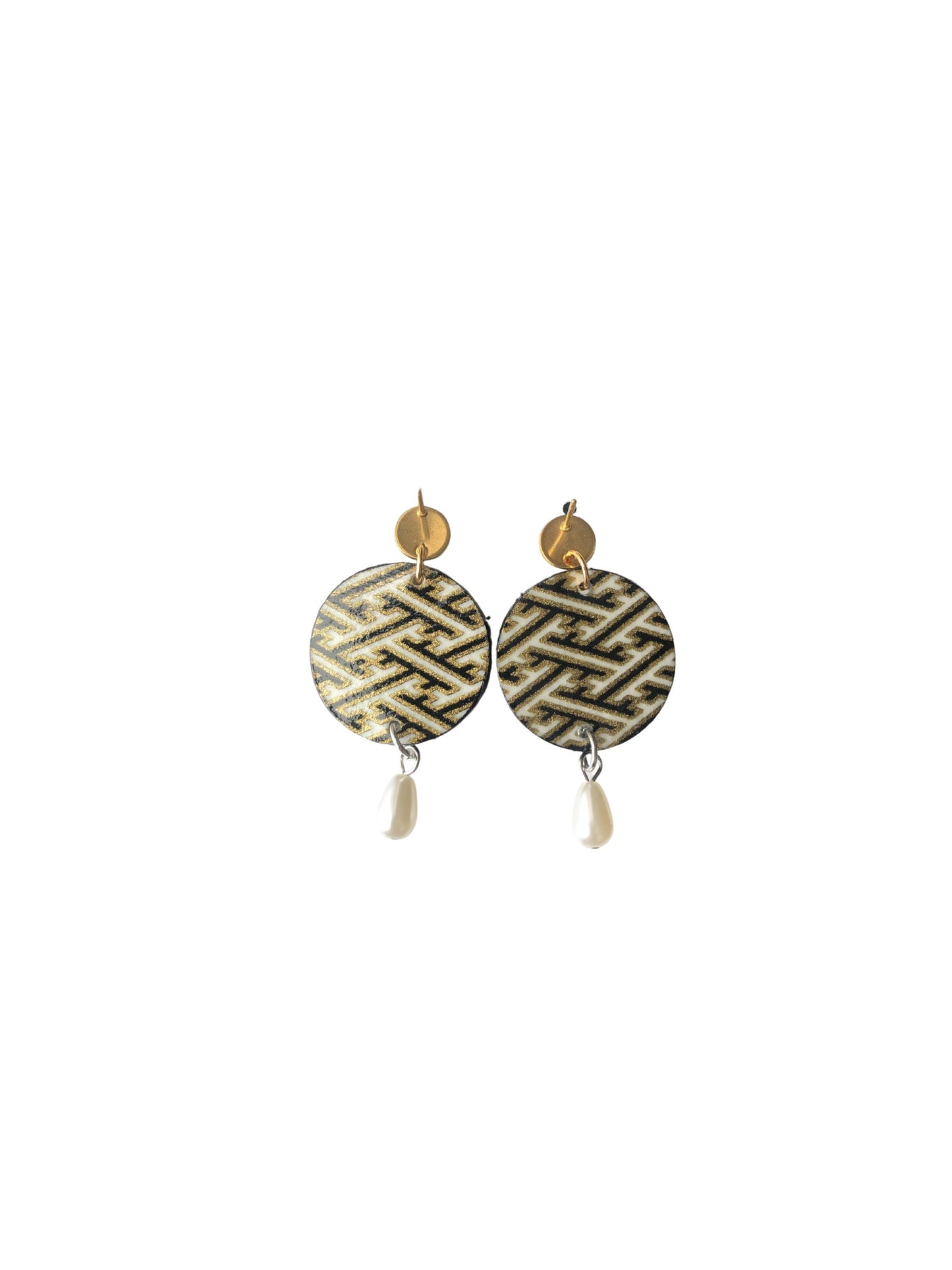 Pair of earrings with geometric design on a white background