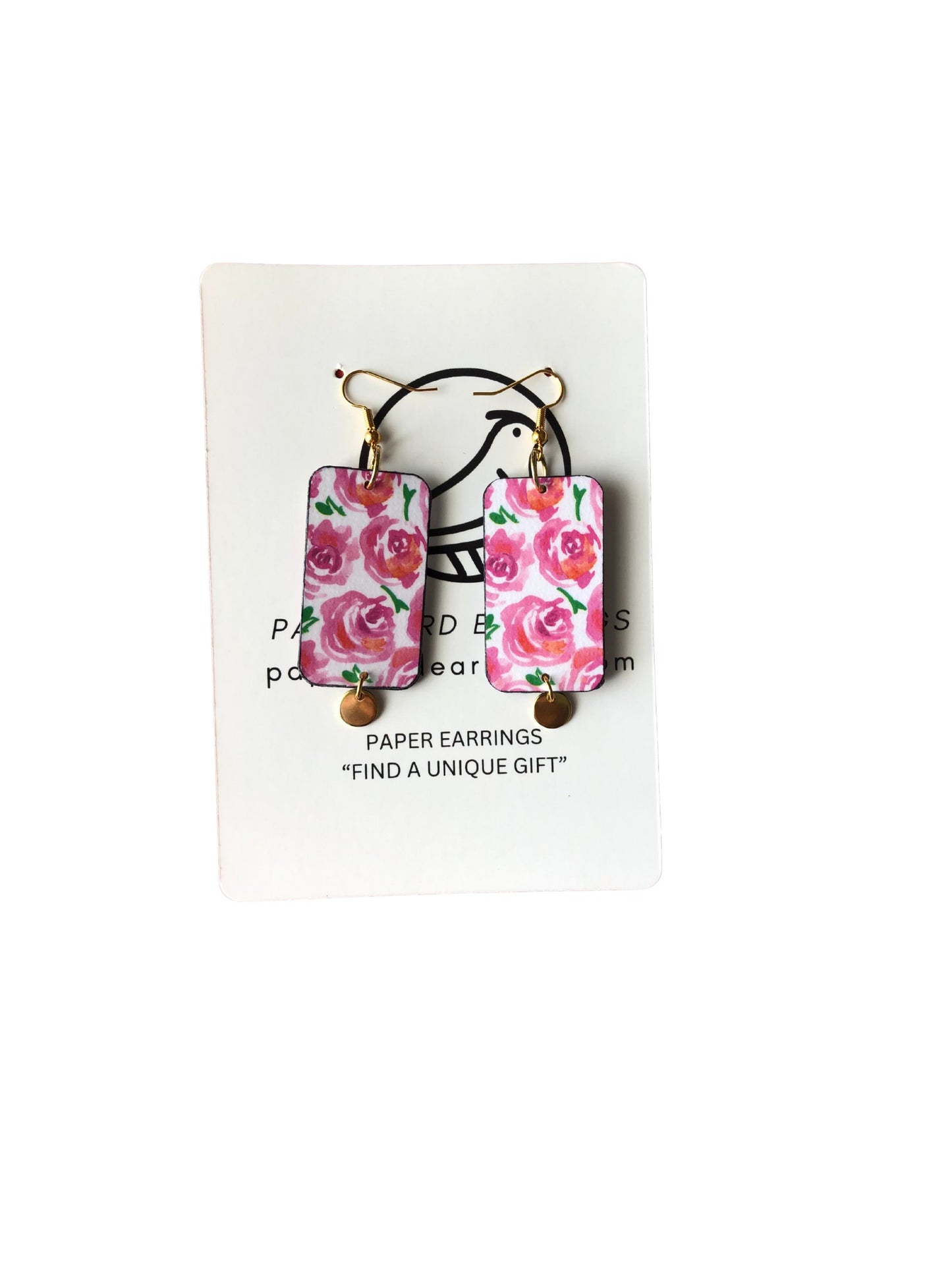 Floral paper earrings on a white card with text