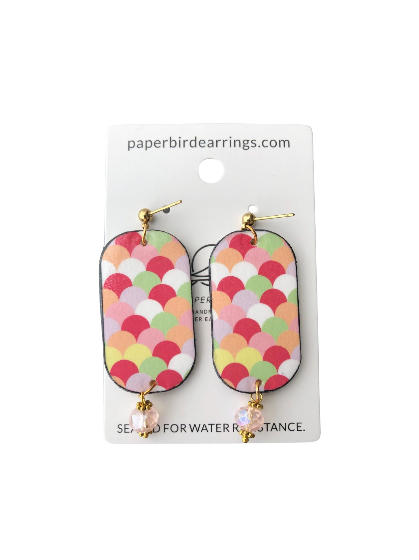 Colorful scale-patterned earrings on a branded card with 'paperbirdearrings.com' text.