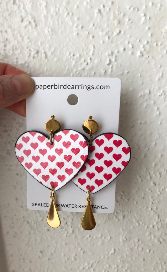 Heart-shaped earrings with red heart pattern 