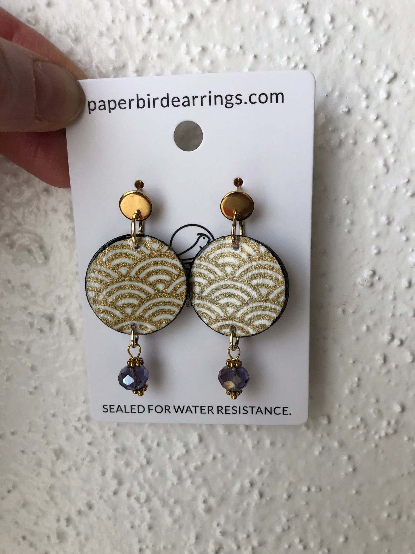 round white earrings with gold pattern