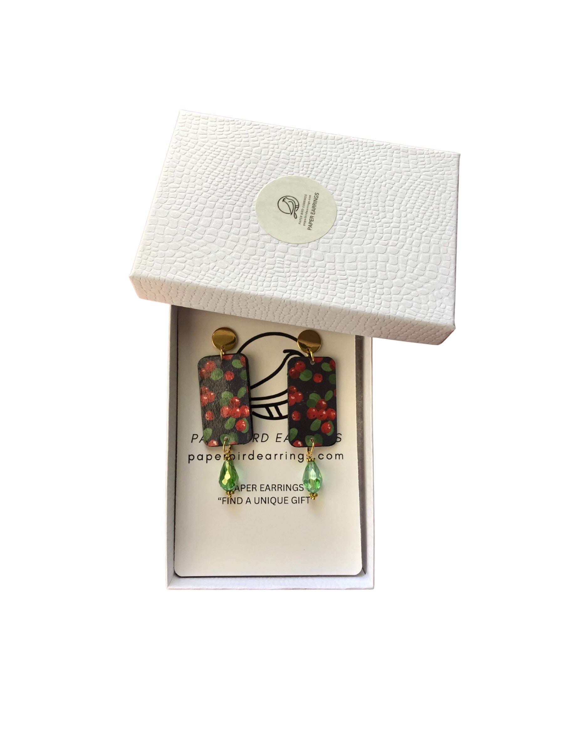 Pair of earrings in a white box with a visible brand label.